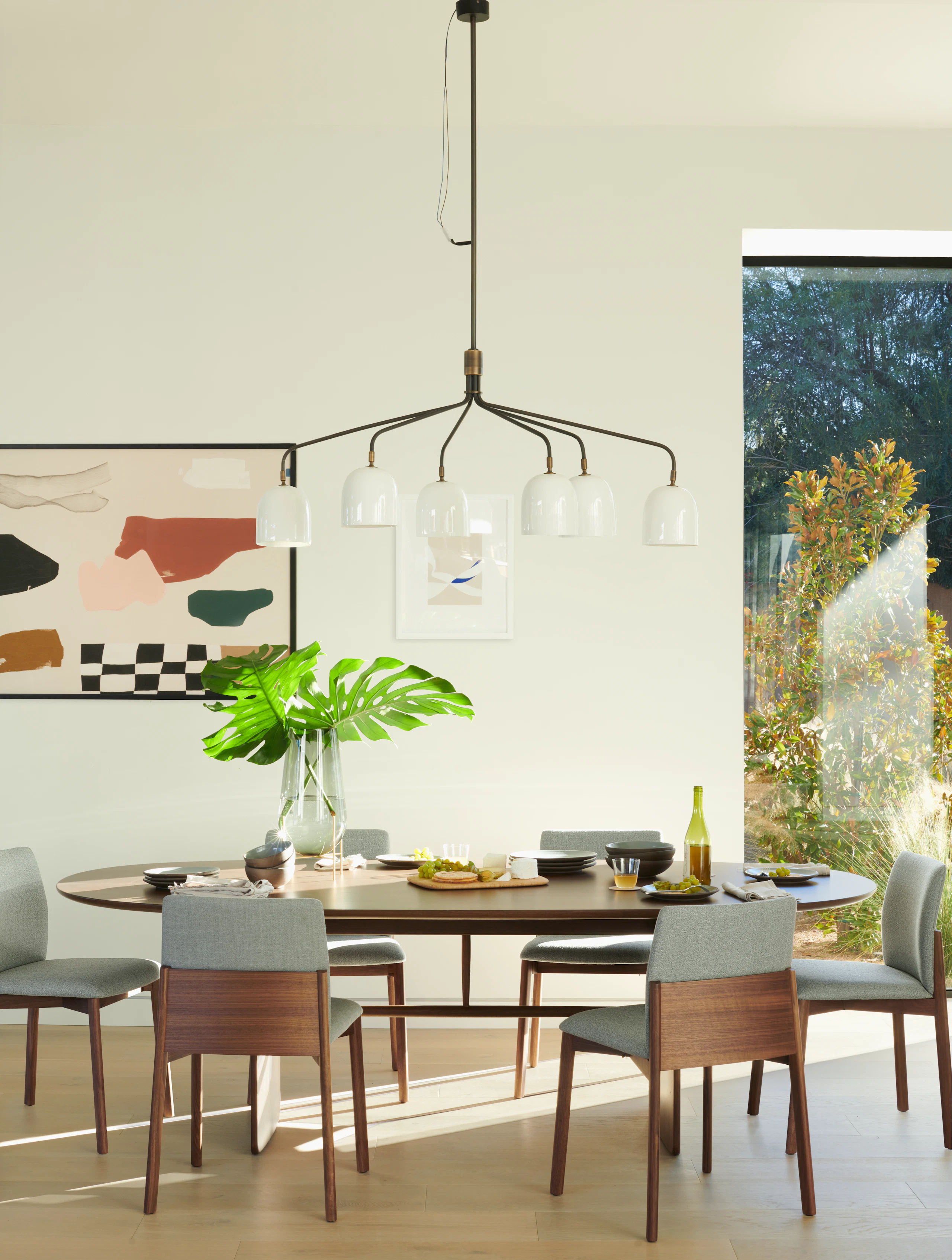 Pennon Dining Table, Contour Chair, Howard Chandelier, Echasse Vase, "Blue Moving"" by Senem Oezdogan, ""Riviera"" by Karina Bania"