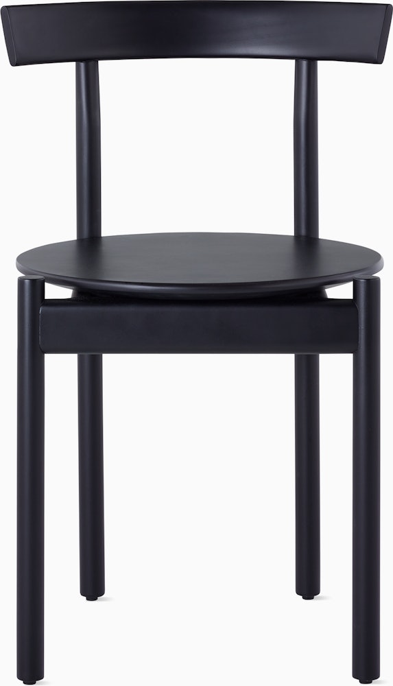 A black Comma Chair, viewed from the front.