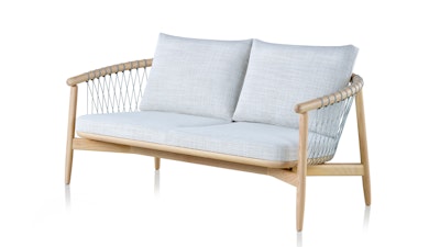 A light grey Crosshatch Settee by Geiger with a wooden frame