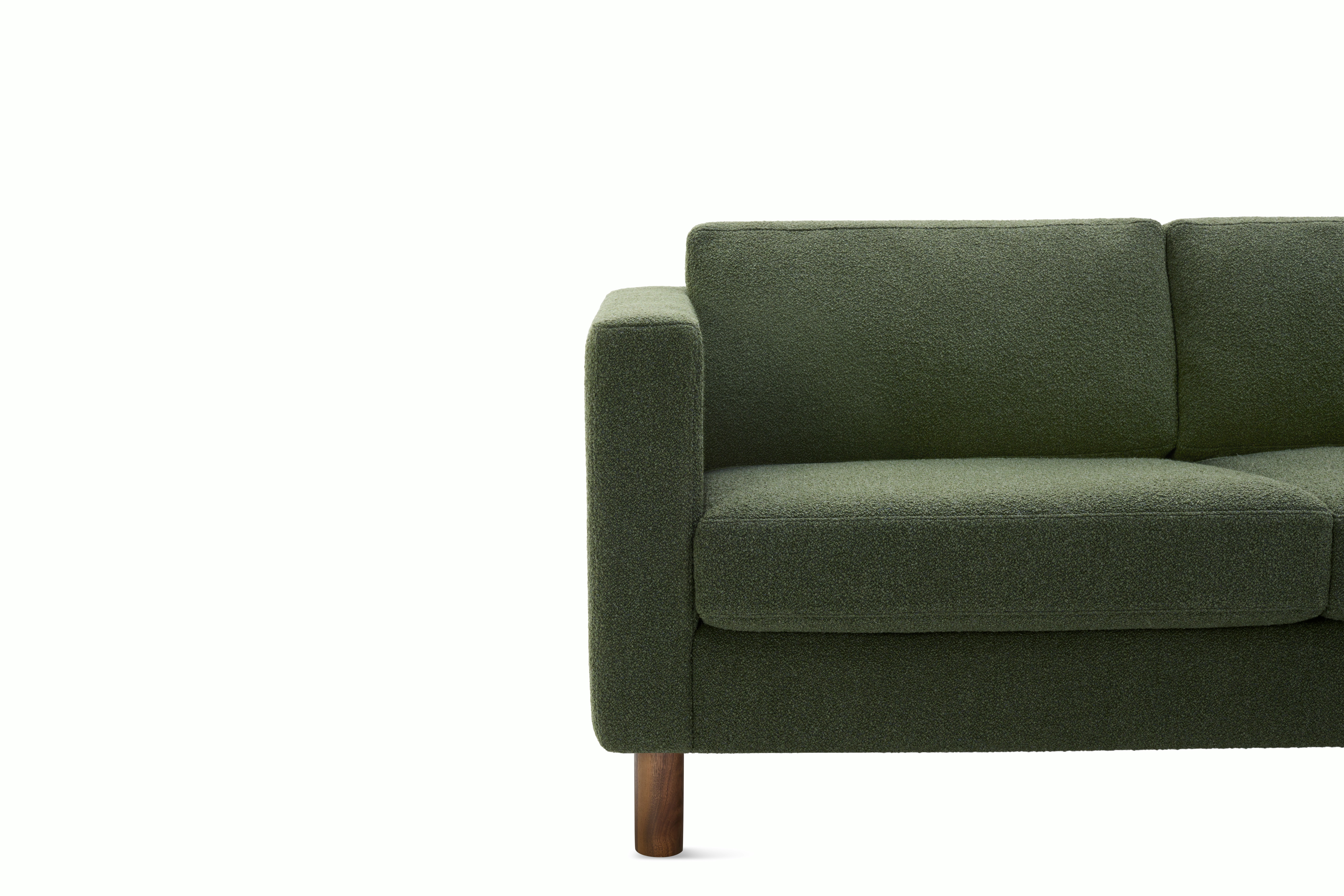 Detail view of three seater Lispenard Sofa, 17" in dark green textile and 6" walnut legs.
