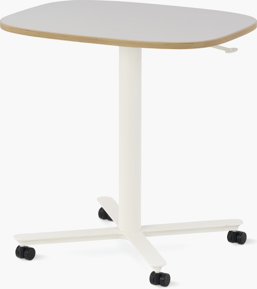 Large Passport Work Table with white surface, plywood edge and white base on casters.