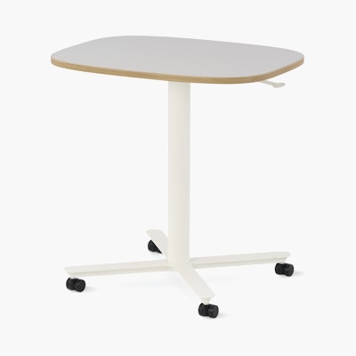 Large Passport Work Table with white surface, plywood edge and white base on casters.