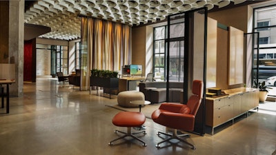 A Florence Knoll Credenza, Knoll High Back Lounge Chair and Ottoman, Eero Saarinen Side Table, Muuto Five Pouf, and Knoll k. lounge at the Washington D.C. Knoll showroom