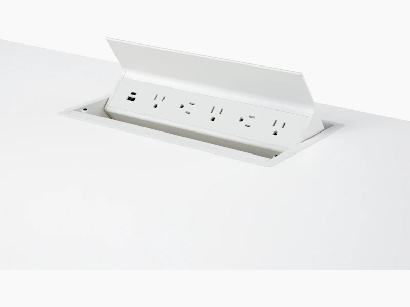 USB-A port, USB-C port, and five A/C power outlets on an embedded table power source.