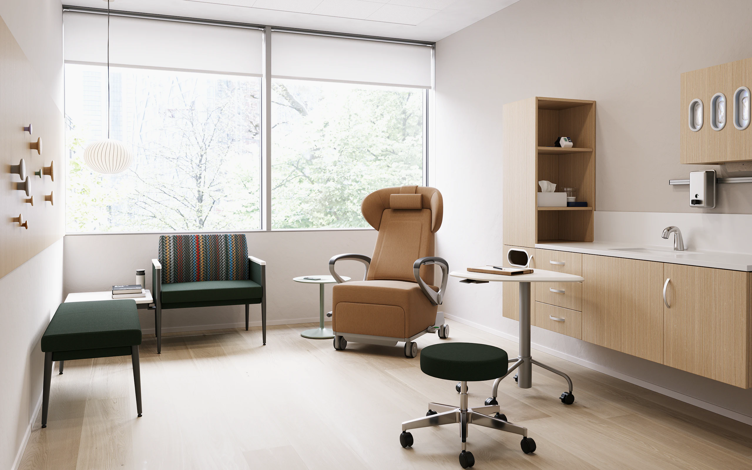 Exam room with casework against the side wall, a recliner, and side seating.