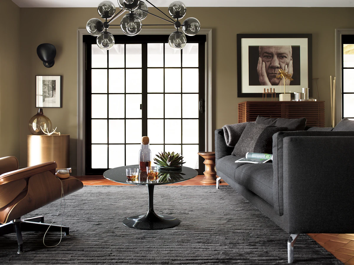 Modern living room with dark gray sofas and round coffee table