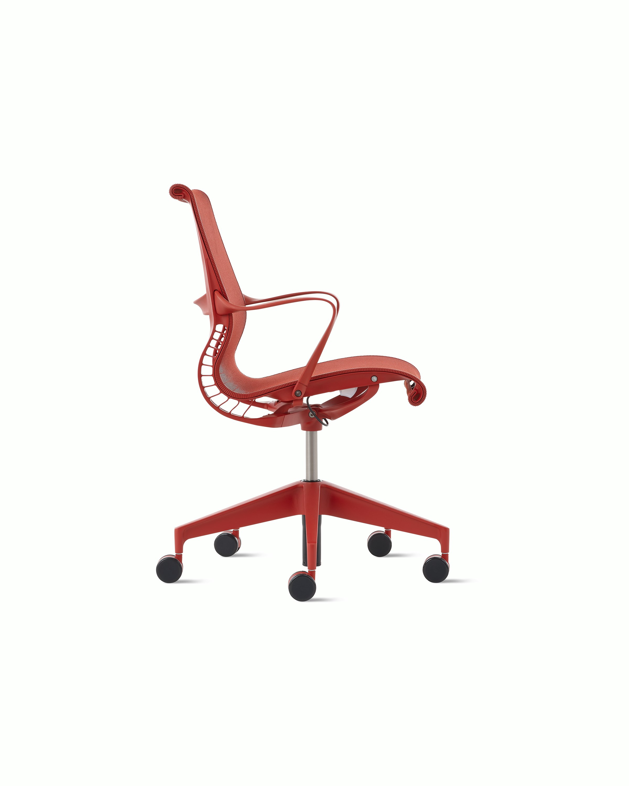 Side view of a Setu chair with fixed arms in red.