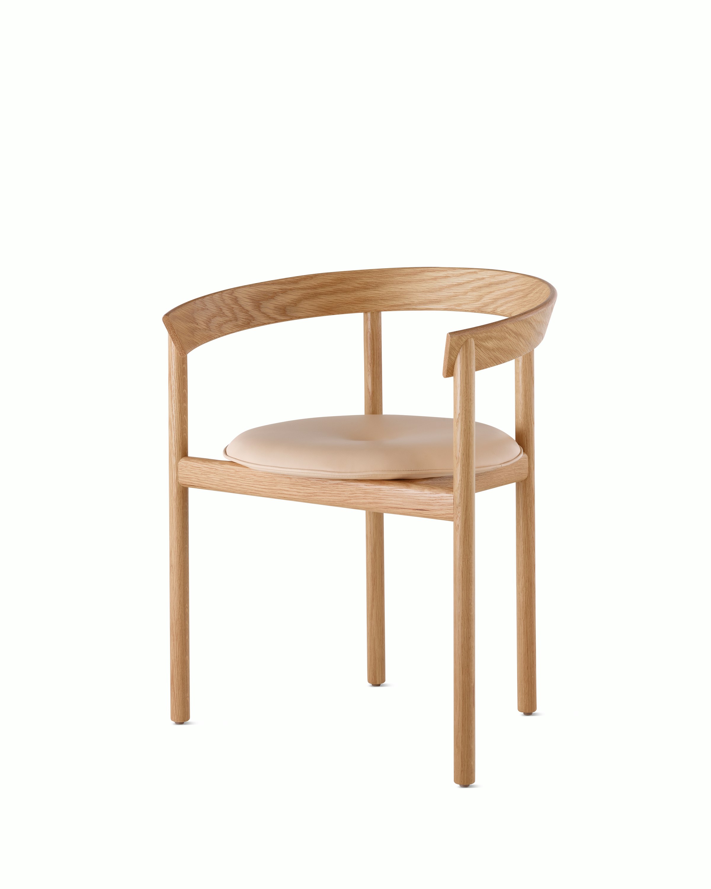 An oak Comma Chair with arms and a seat pad, viewed from the front at an angle.
