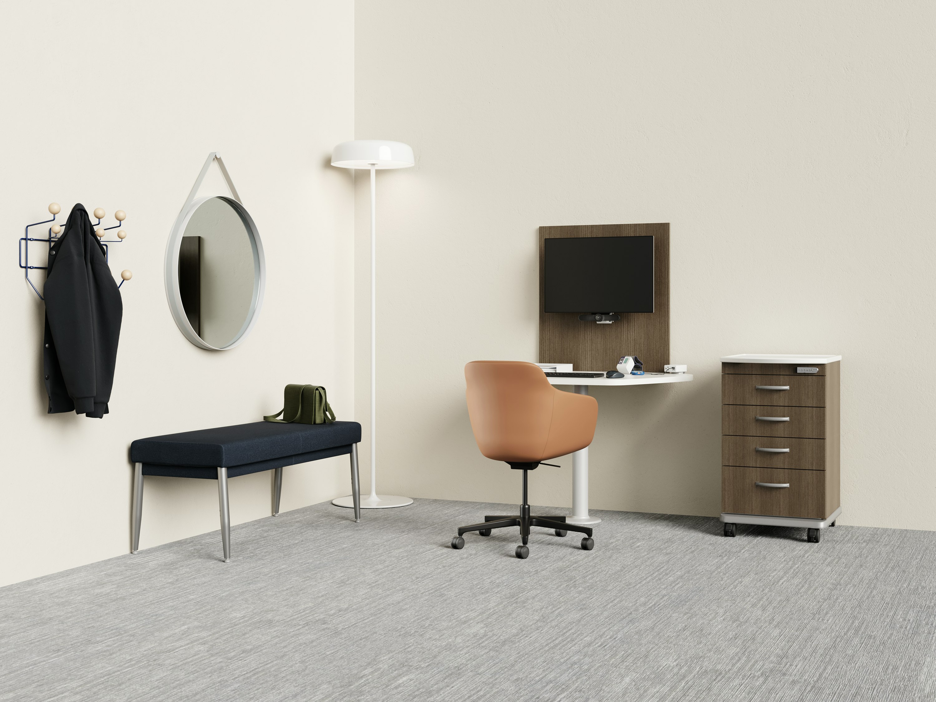 Telemedicine space with Mora casework wall unit and peninsula table and a Mora supply cart with a Geiger Saiba chair with a Nemschoff Palisade bench with an Eames Hang-it-All with a Hay Strap Mirror with an Ode Lamp.