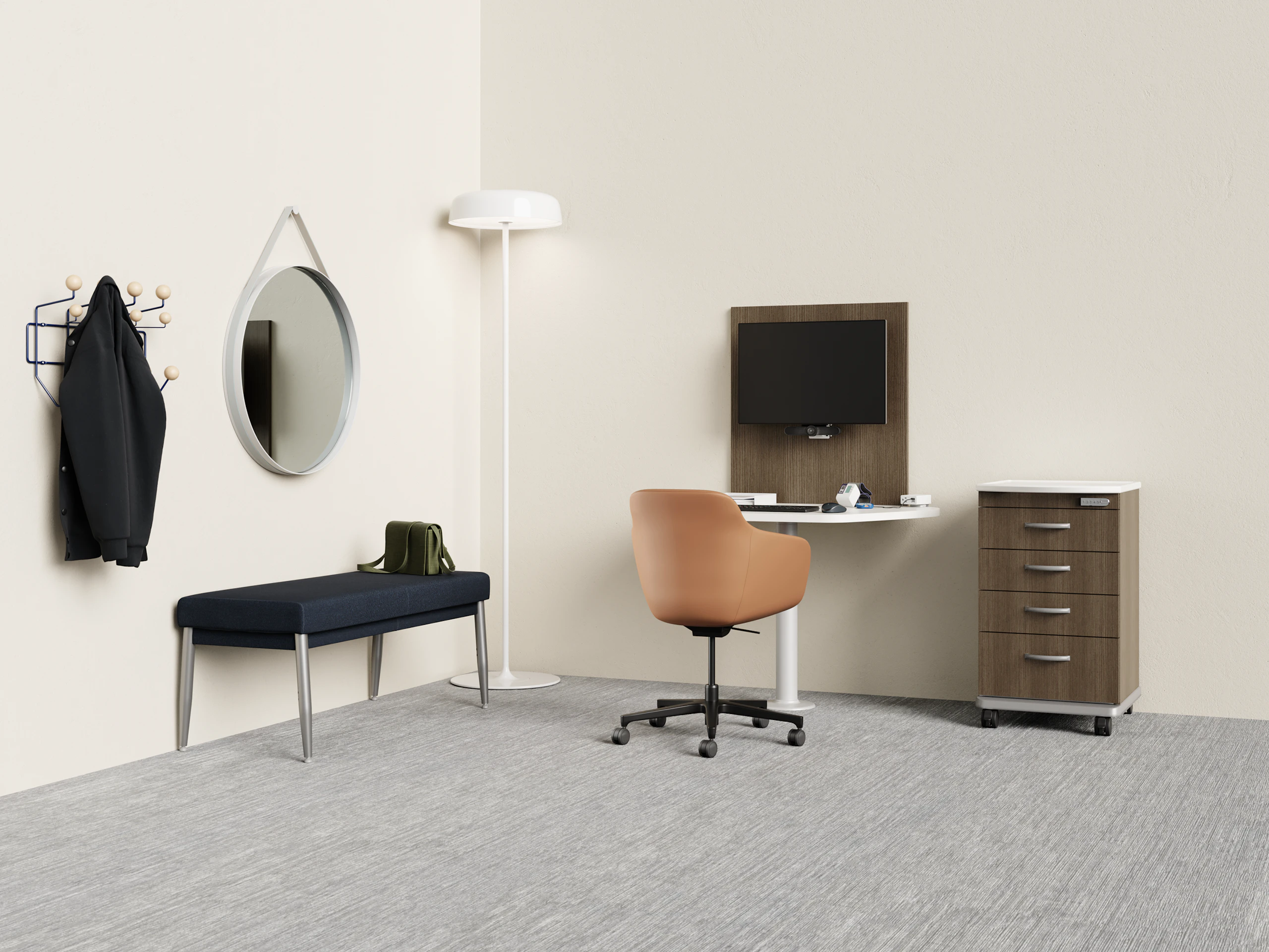 Telemedicine space with Mora casework wall unit and peninsula table and a Mora supply cart with a Geiger Saiba chair with a Nemschoff Palisade bench with an Eames Hang-it-All with a Hay Strap Mirror with an Ode Lamp.