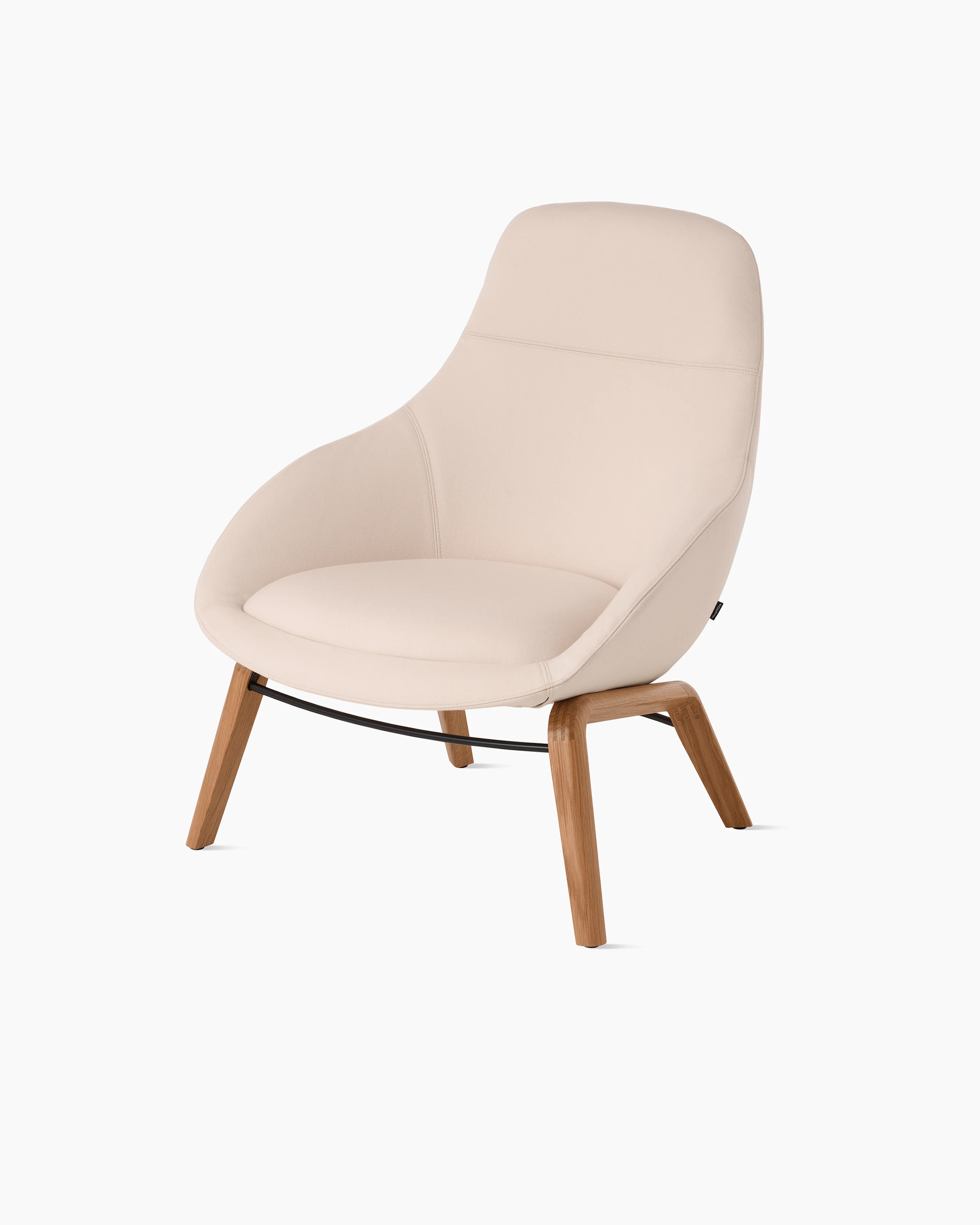White background shot of Always Lounge Chair with cream fabric and wooden legs.
