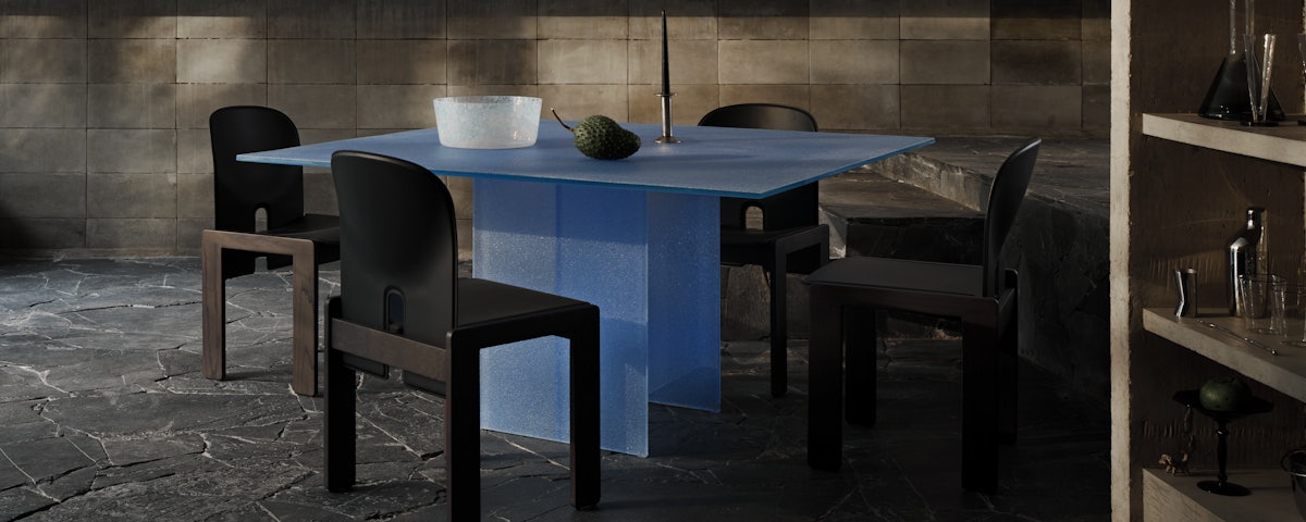 Simoon Table, Scarpa Chairs and Totem Pendant in a dining room setting