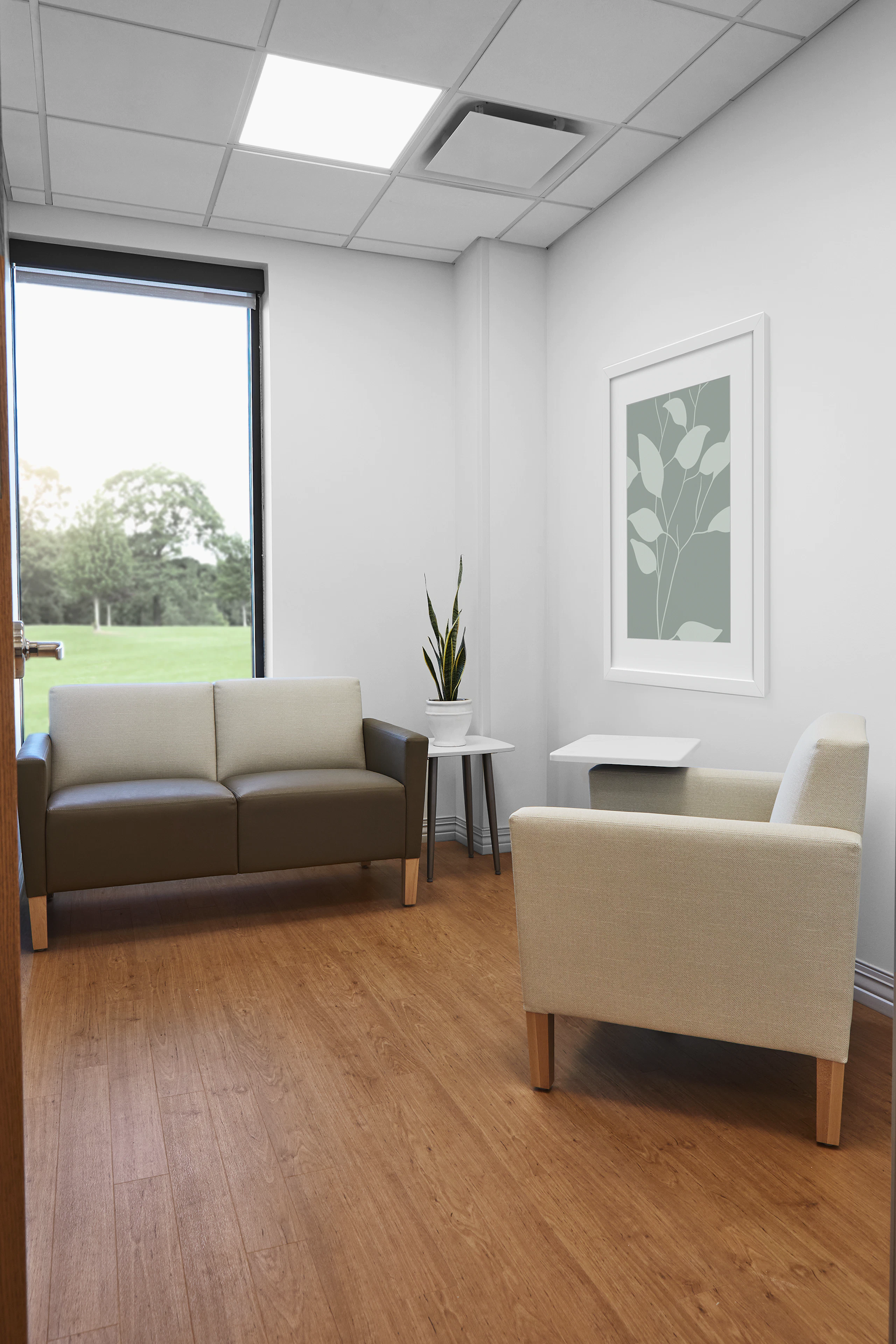 Patient consultation room with Nemschoff Brava Classic arm chair in beige and Brava Classic Multiple Seating in a brown seat and beige back with a Nemschoff Palisade Mobile Table and a Nemschoff Palisade Side Table.