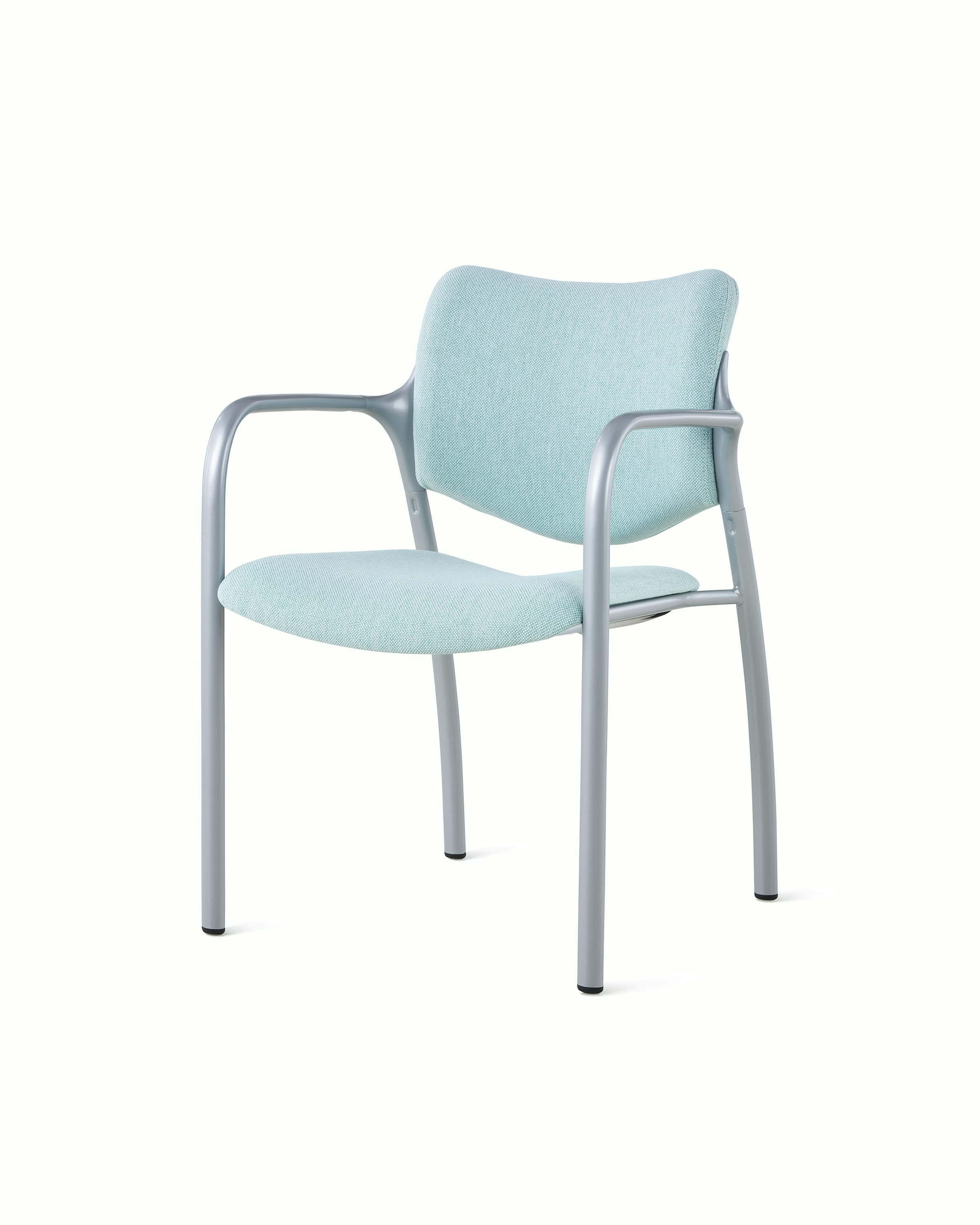 An Aside Chair with light green upholstered seat and back, viewed at an angle.