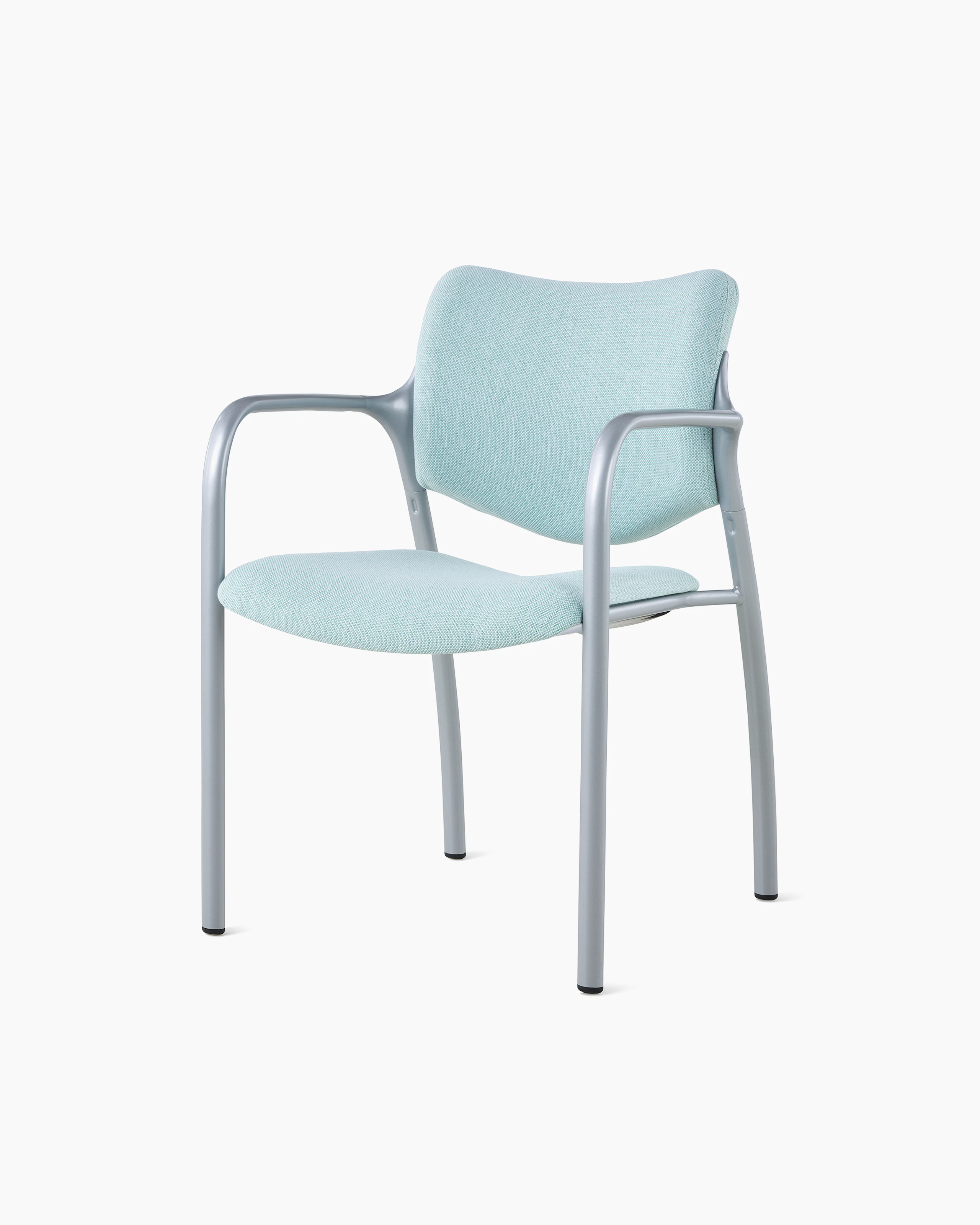 An Aside Chair with light green upholstered seat and back, viewed at an angle.