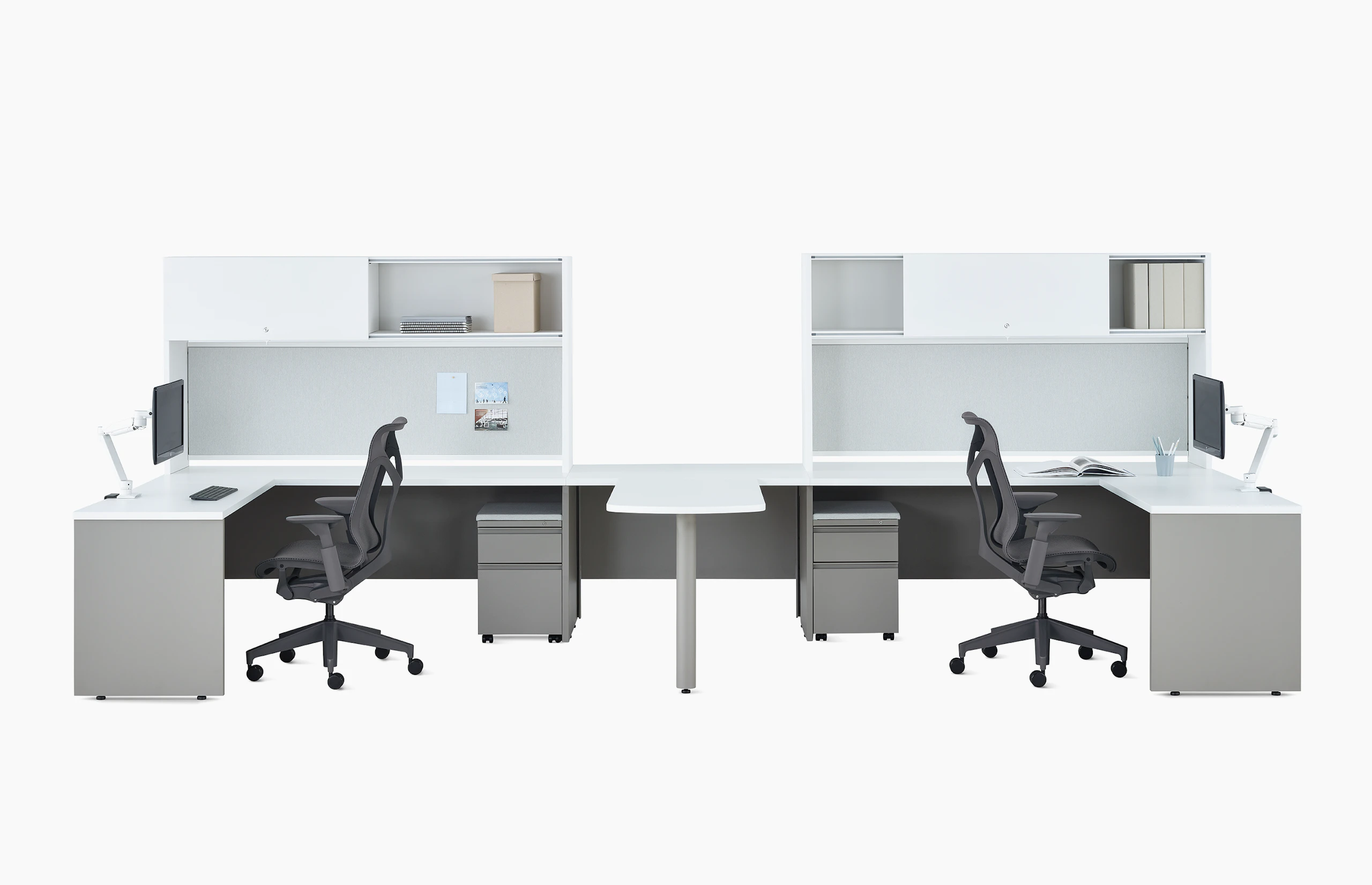 Two white and gray Canvas Metal Desks with upper storage, Concerto Monitor Arms, and dark gray Cosm Chairs.