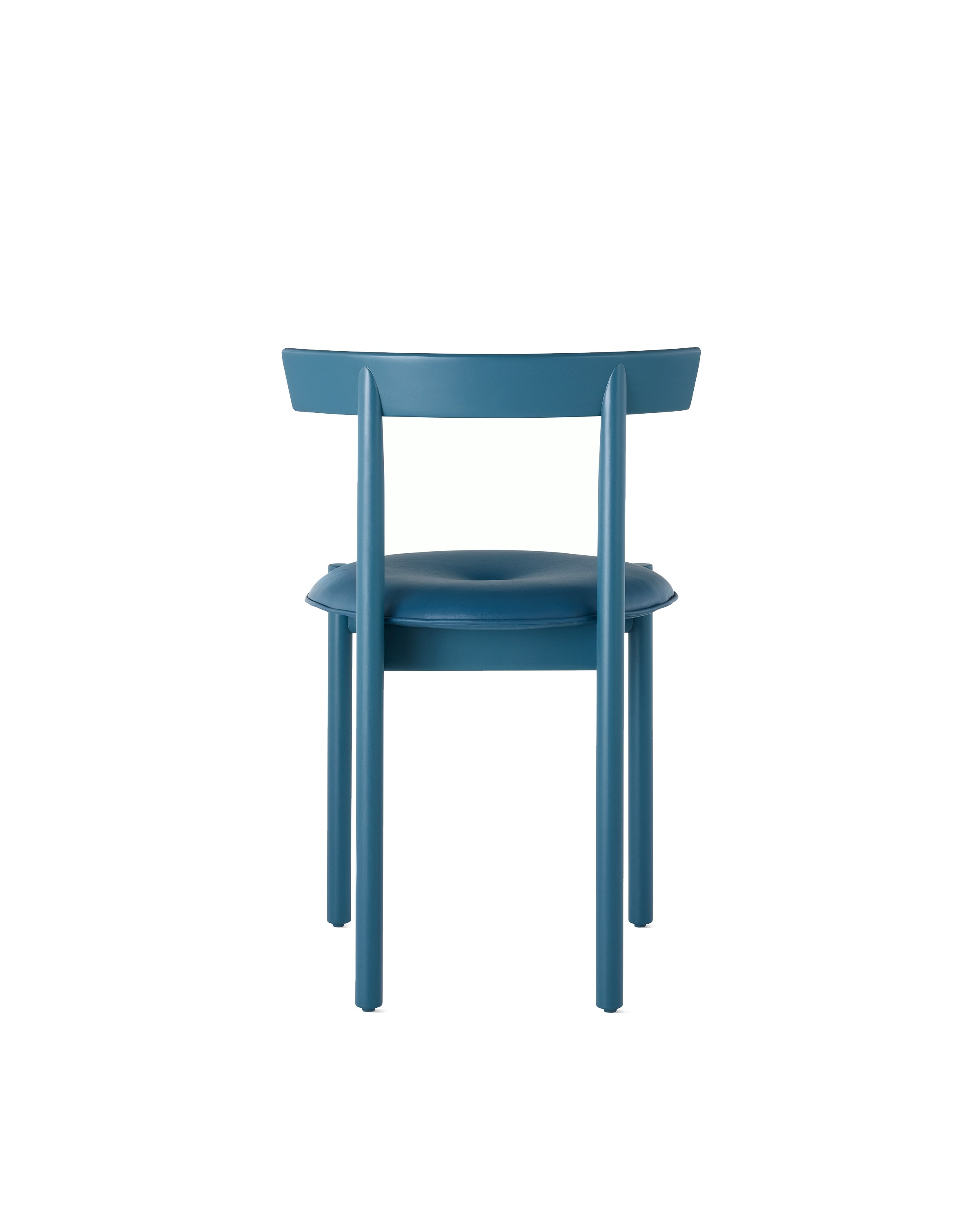 A blue Comma Chair with a seat pad, viewed from the back.