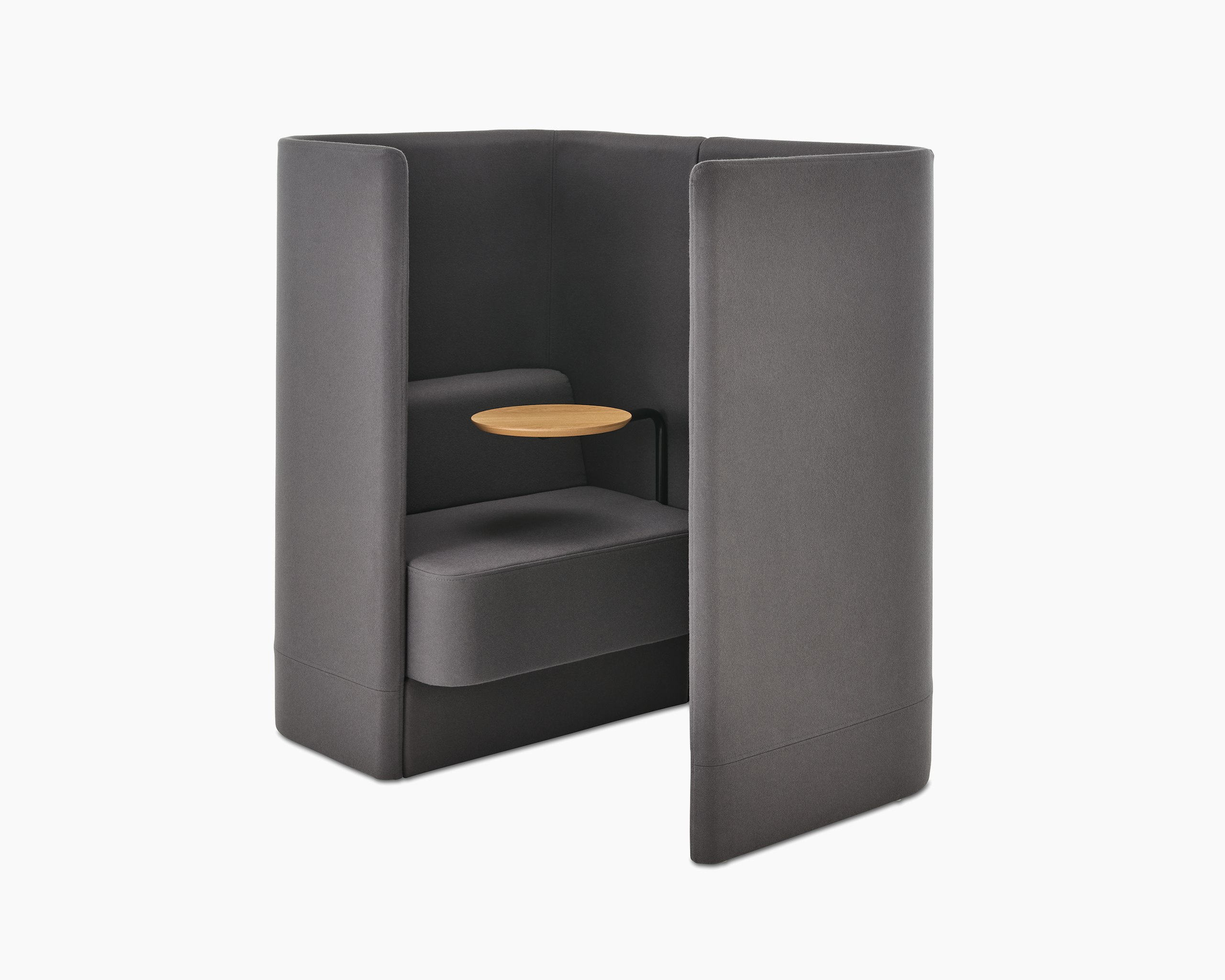 Whitesweep shot of Pullman Chair Pod upholstered in dark grey fabric, with tablet arm and screen left.