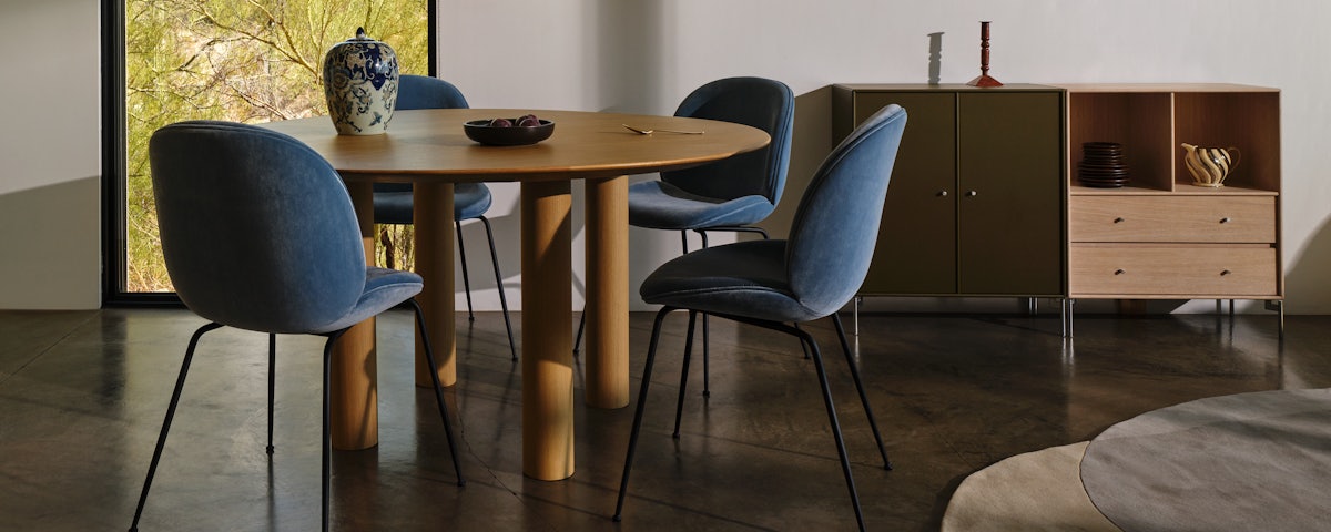 Montana Furniture Dining Cabinet, Beetle Dining Chairs and Earth Table in a dining room setting