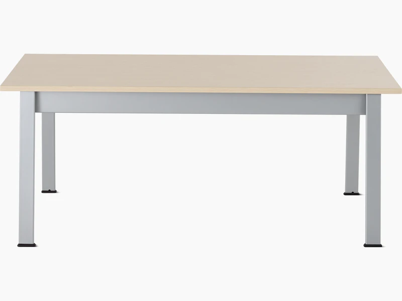 Front view of an Easton Coffee Table with a clear on ash laminate top and metallic silver legs.