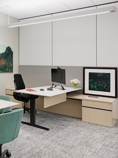 A Canvas Channel workstation featuring Renew sit-to-stand tables at the BlackRock office in New York City