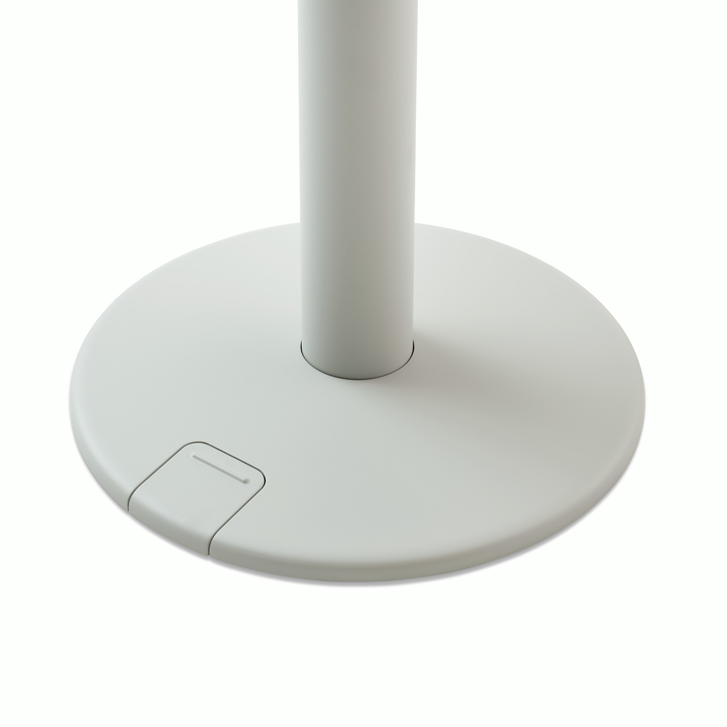 Detail of a grey OE1 Sit-to-Stand Table base with foot-controlled up-down pedal, viewed from an angle.