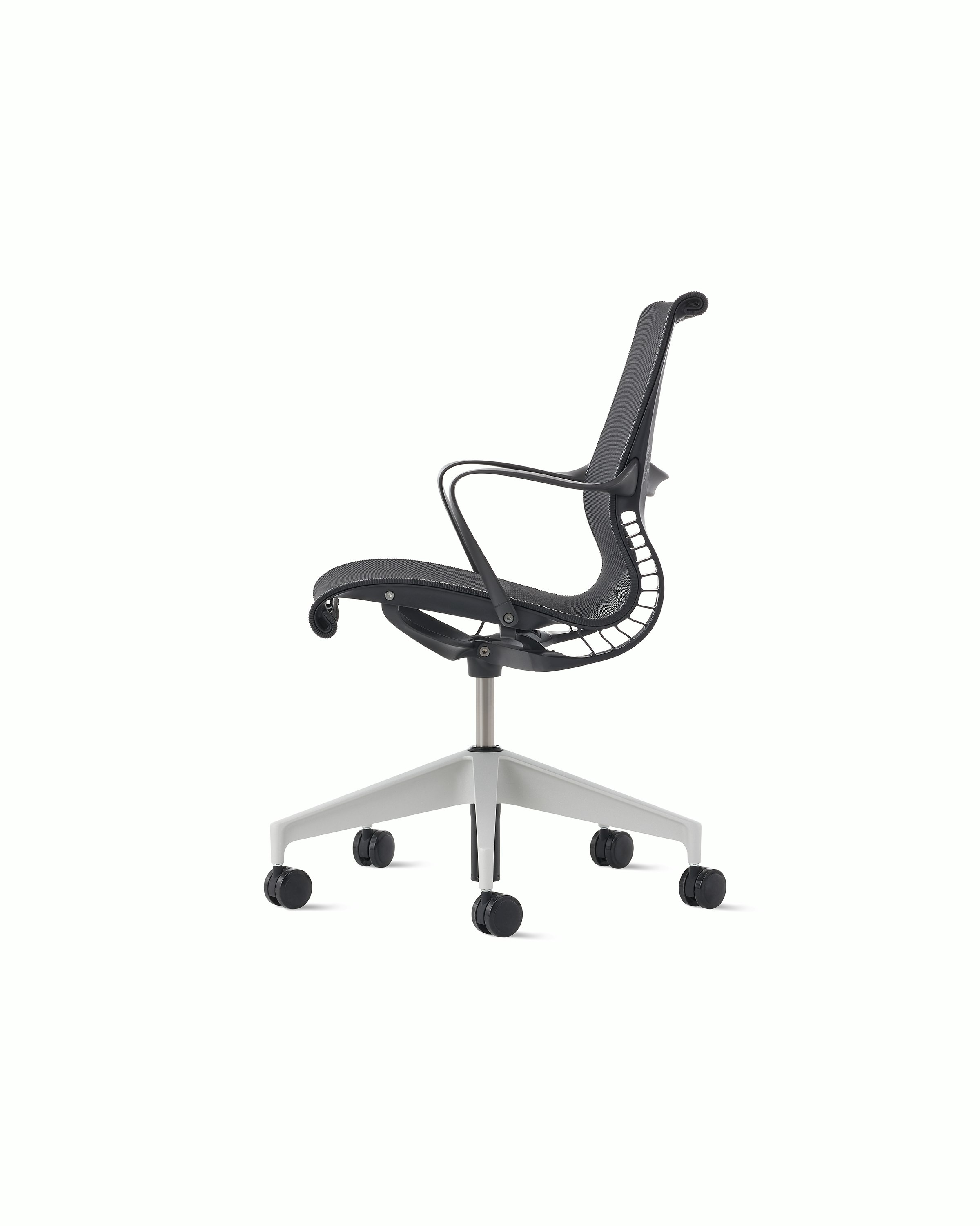 Side view of a Setu chair in dark grey with a silver alloy base.