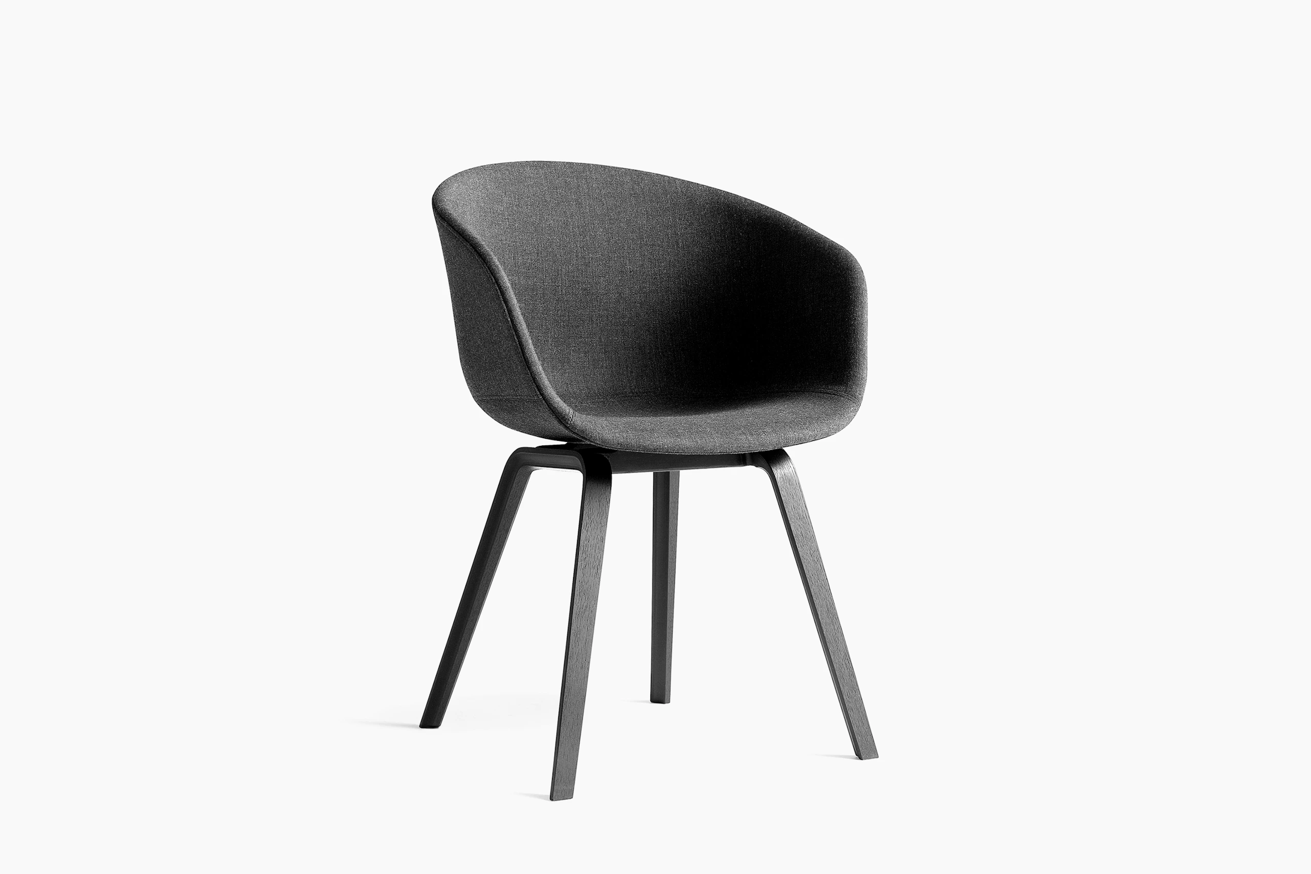 Grey upholstered About A Chair with black wooden base, viewed at an angle.