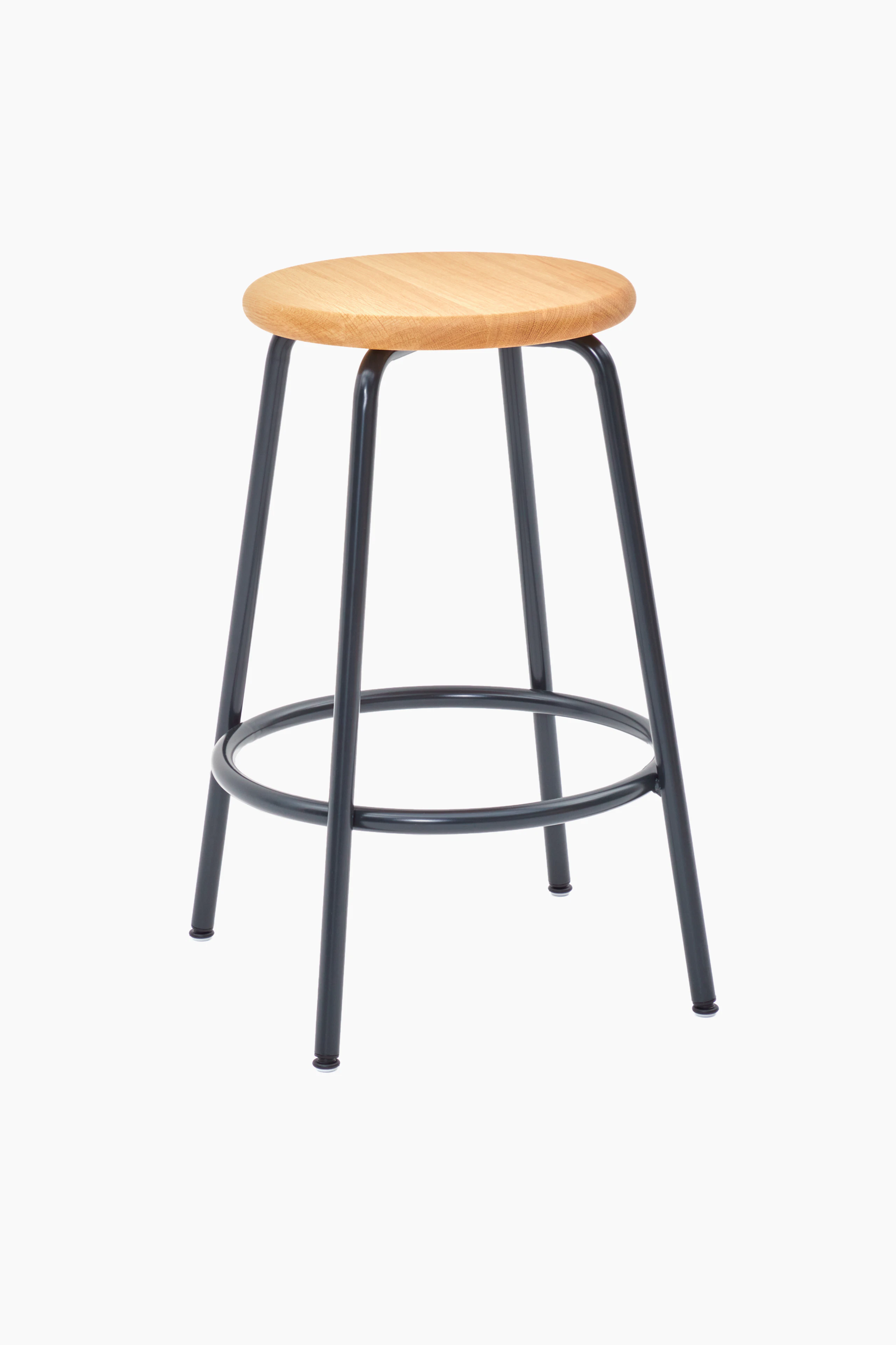 A Penny Stool with a black base and oak seat.