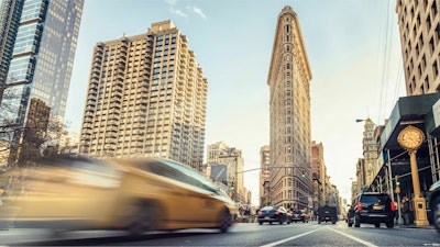 Cars driving through the Flatiron District in New York City