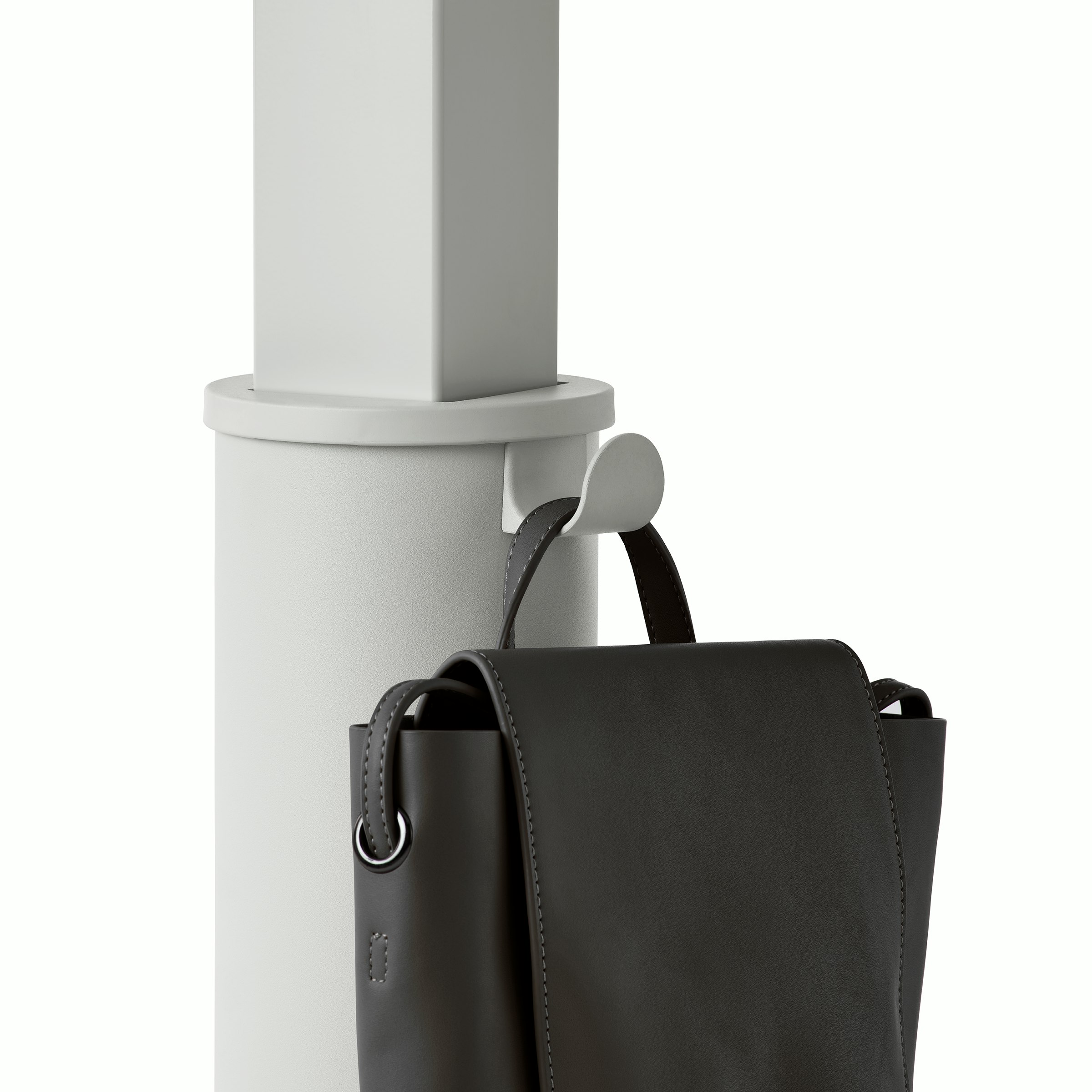 Detail of a grey OE1 Sit-to-Stand Table column with a black bag hanging from the bag hook.