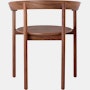 A walnut Comma Chair with arms, viewed from the back.