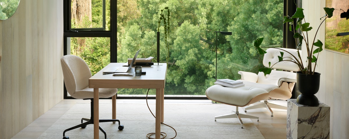 Statis Handloomed Wool Rug, Leatherwrap Sit-to-Stand Desk and Beetle Task Chair in a home office setting