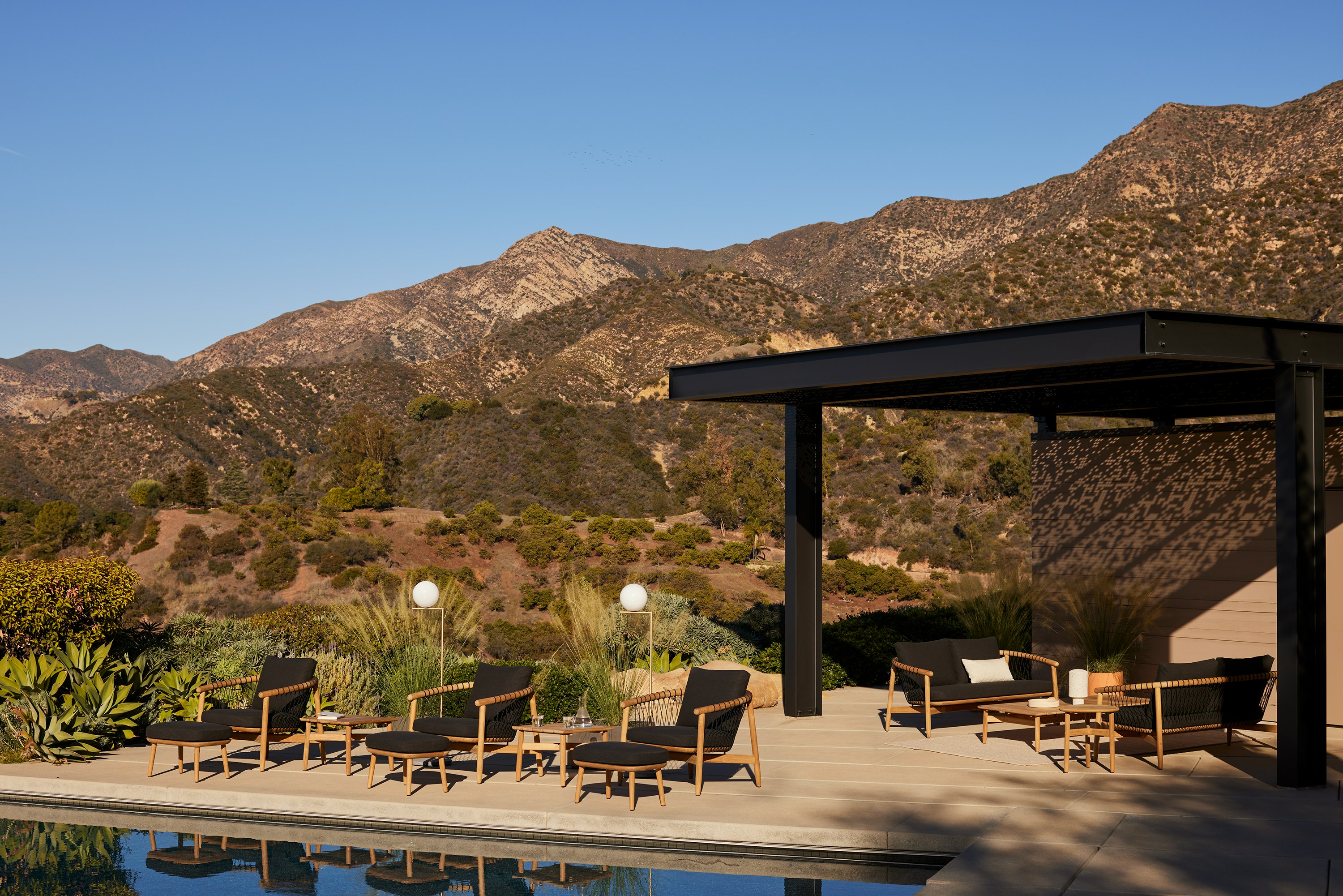 Geiger Crosshatch Outdoor Lounge Chairs, Settees and Occasional Tables on location.