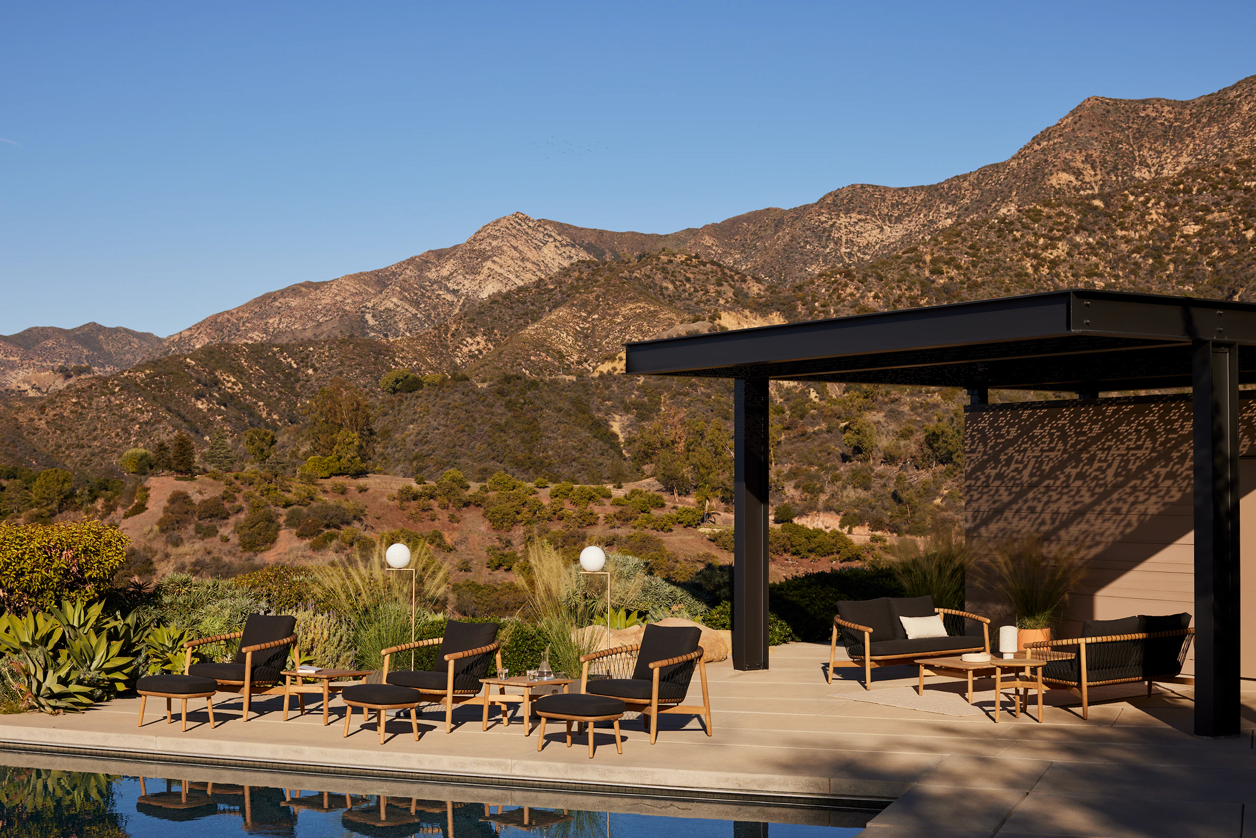 Geiger Crosshatch Outdoor Lounge Chairs, Settees and Occasional Tables on location.