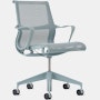 Front angle view of a Setu chair with fixed arms in light blue.
