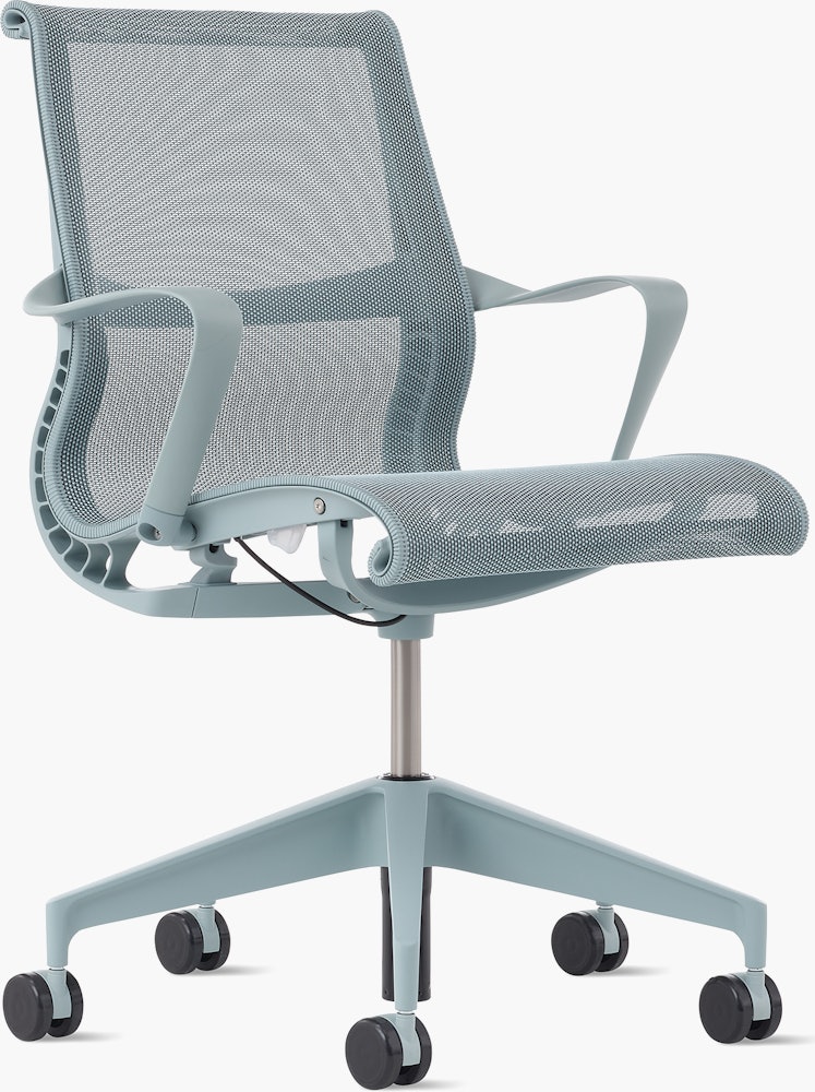 Front angle view of a Setu chair with fixed arms in light blue.