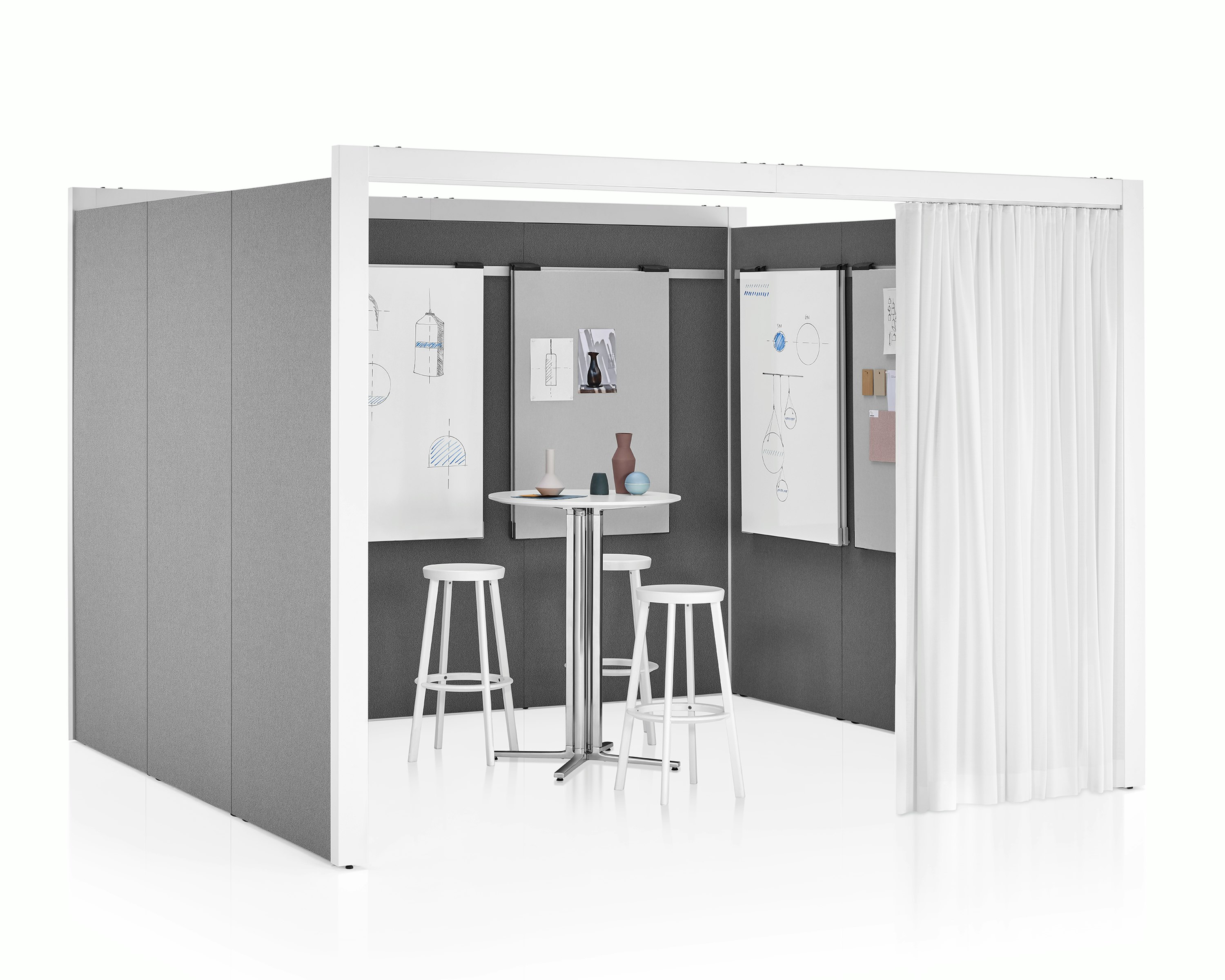 A three-sided Overlay space with tackable gray fabric on the interior and exterior walls. A table, three stools, and markerboards are inside Overlay.