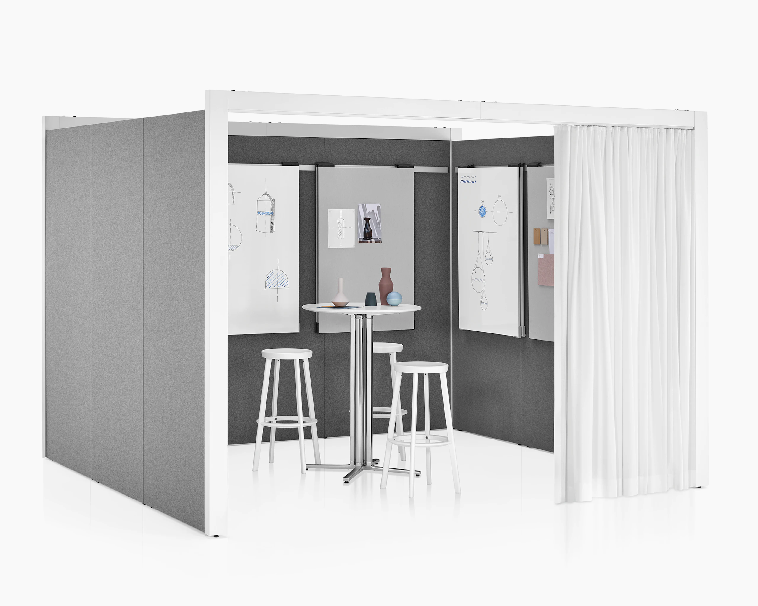 A three-sided Overlay space with tackable gray fabric on the interior and exterior walls. A table, three stools, and markerboards are inside Overlay.