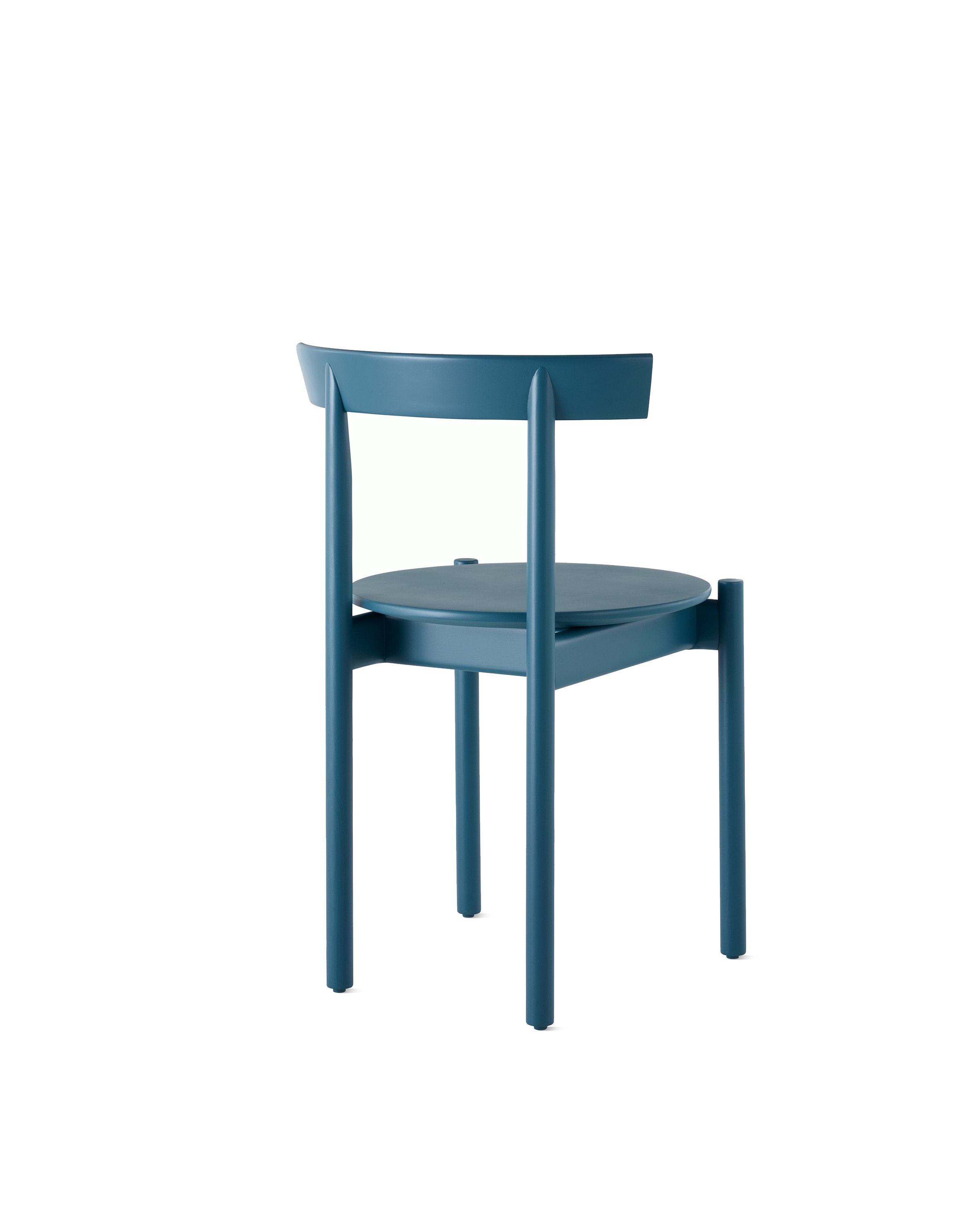 A blue Comma Chair, viewed from the back at an angle.