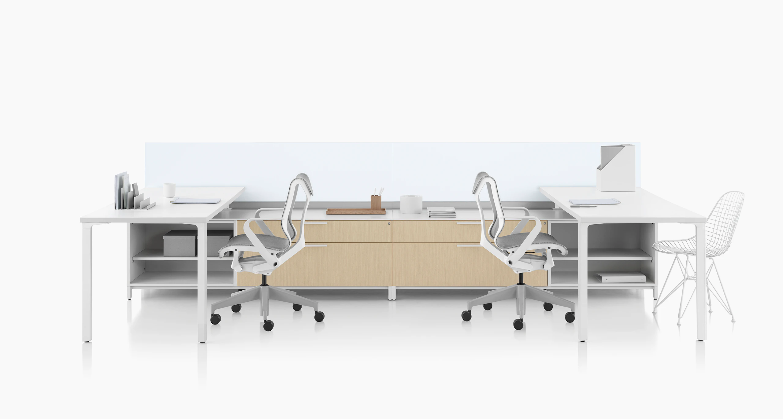 Canvas Dock workstation with white surface, glass screens, and light brown lower storage.