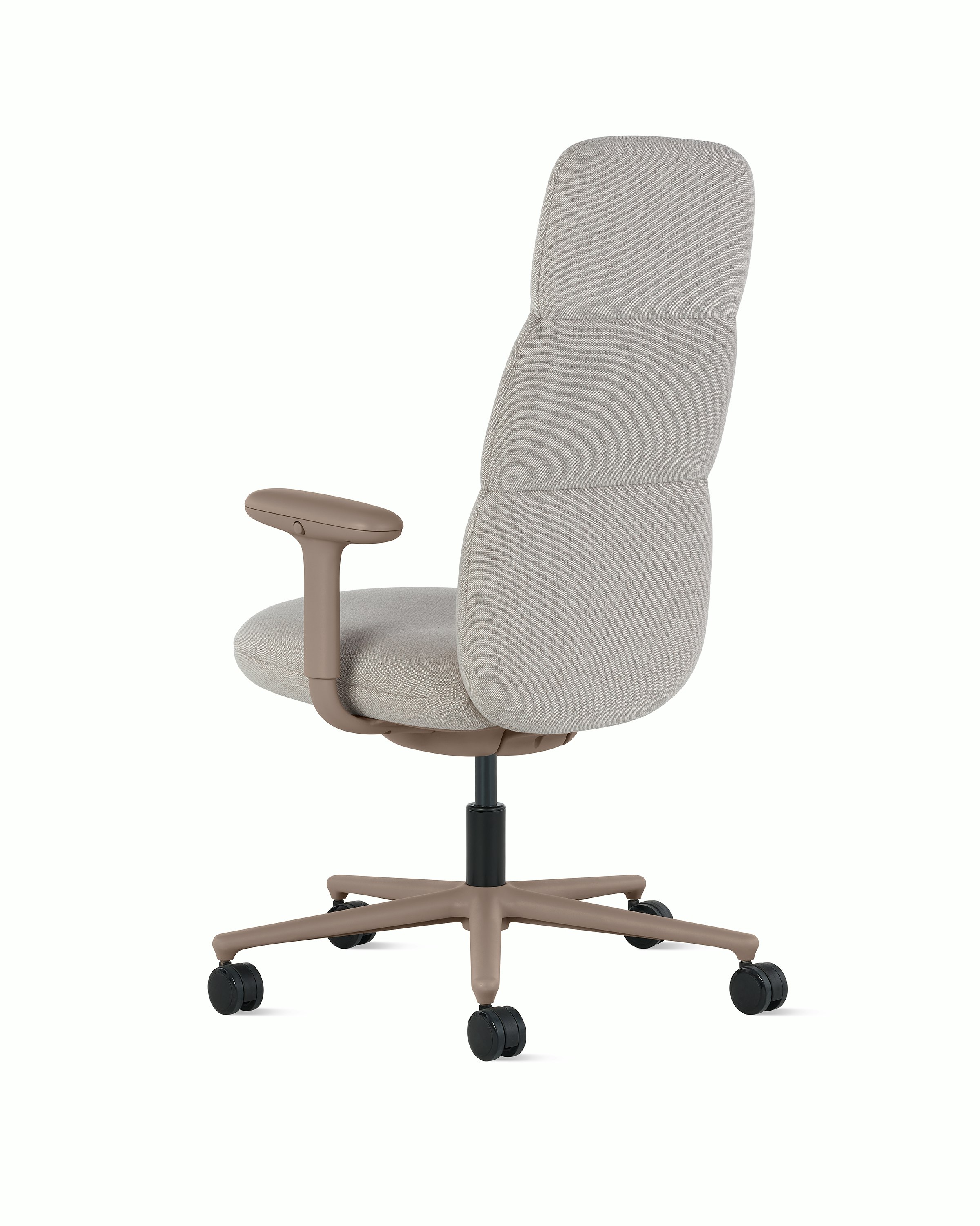 Rear angle view of a high-back Asari chair by Herman Miller in light brown with height adjustable arms.