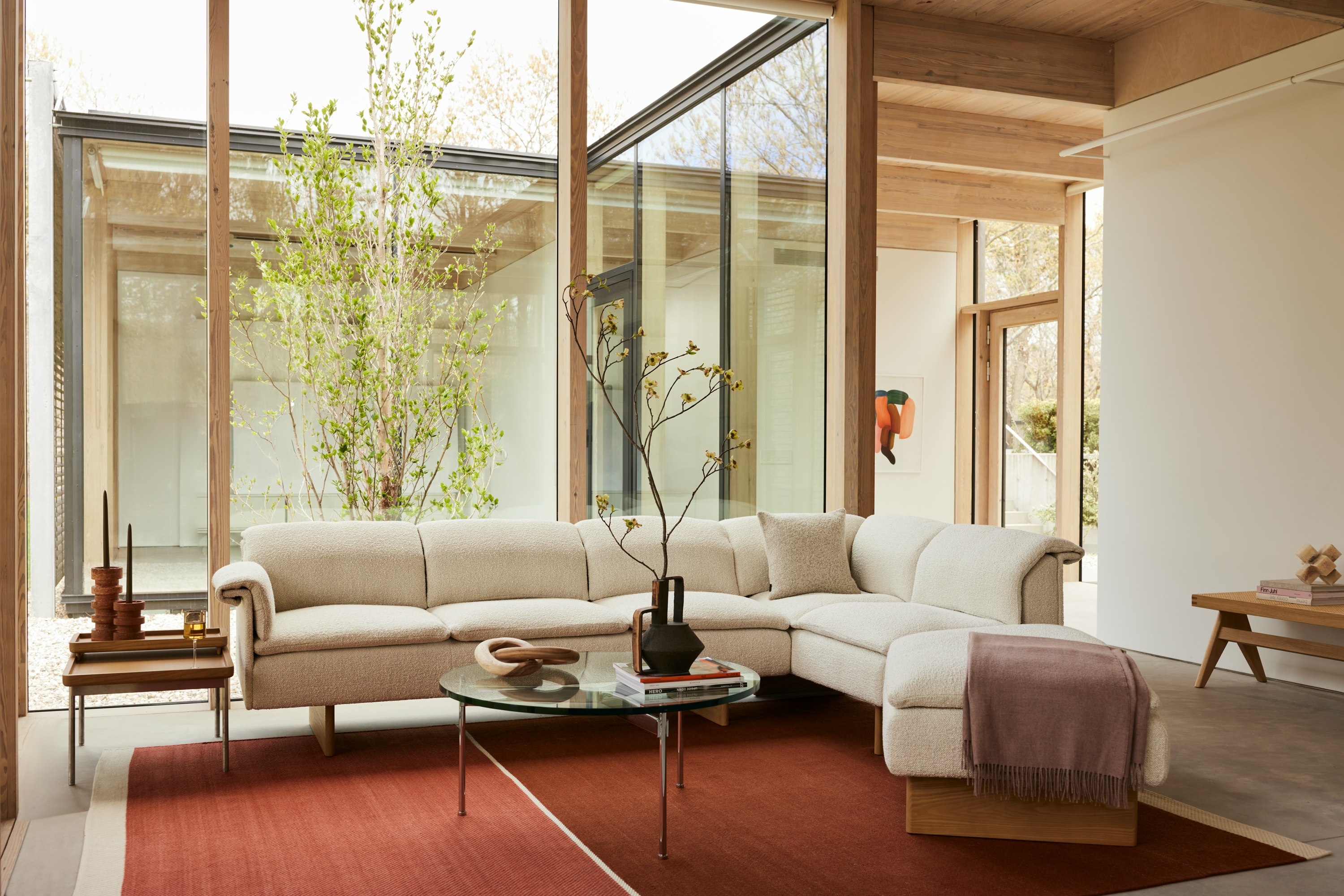 A Geiger residential setting with a Mantle Sectional, Claw Coffee Table and Tuxedo Tray Table.