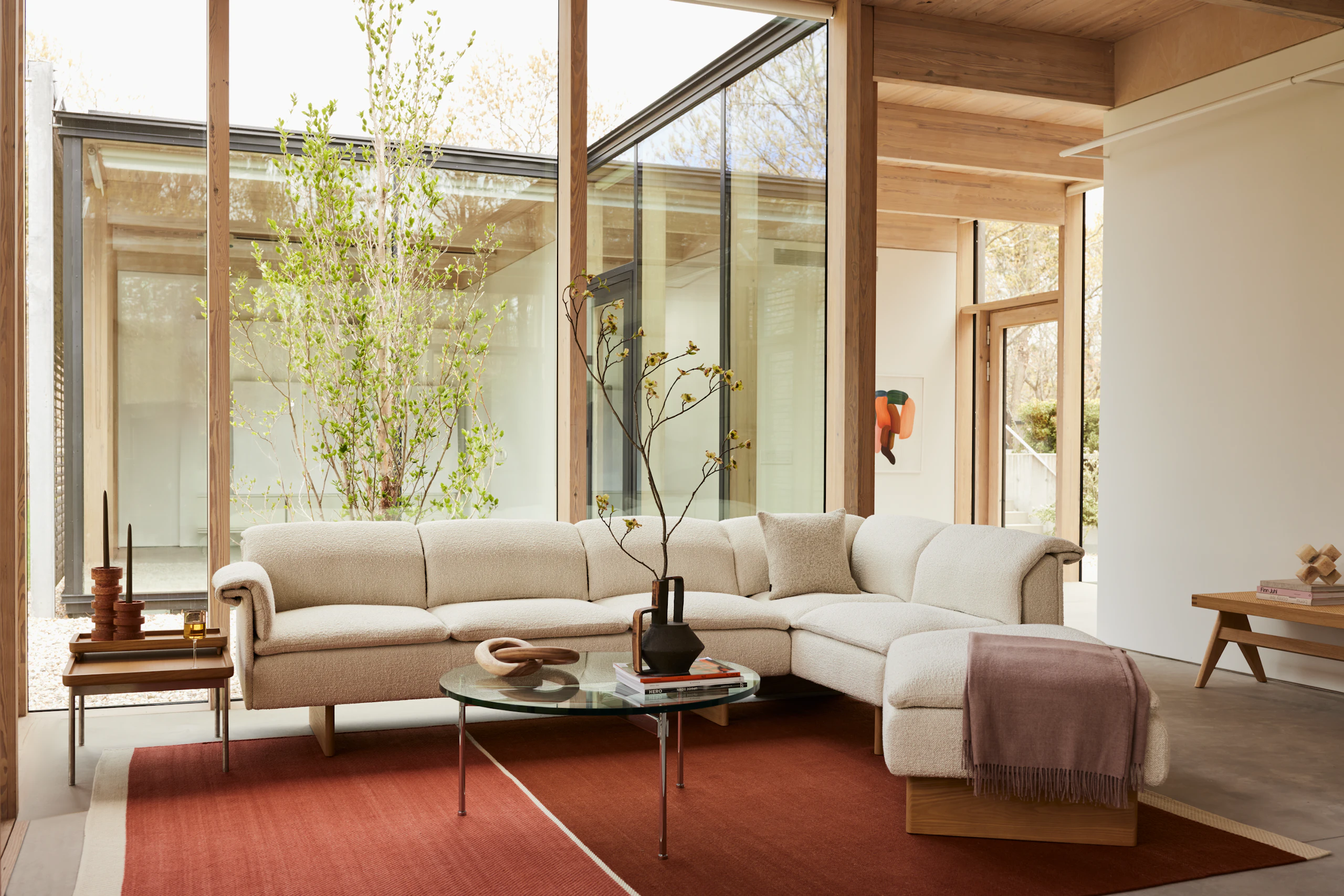 A Geiger residential setting with a Mantle Sectional, Claw Coffee Table and Tuxedo Tray Table.