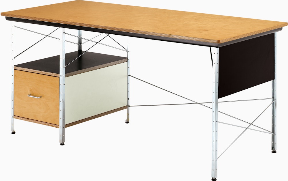 A Eames Desk with a wood and veneer birch top and drawer.