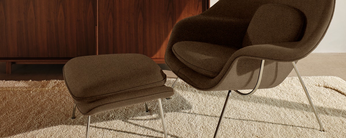 Radius Rug and Womb Chair with Ottoman in a living room setting