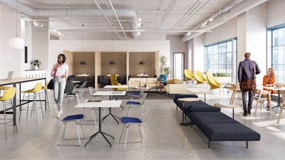 A brightly lit community setting featuring four persons utilizing a variety of colorful seating options including the HAY Uchiwa Lounge Chair, Muuto Base Tables, and Muuto Still Cafe Tables