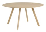 A front view of the Copenhague Dining Table- round in Oak.