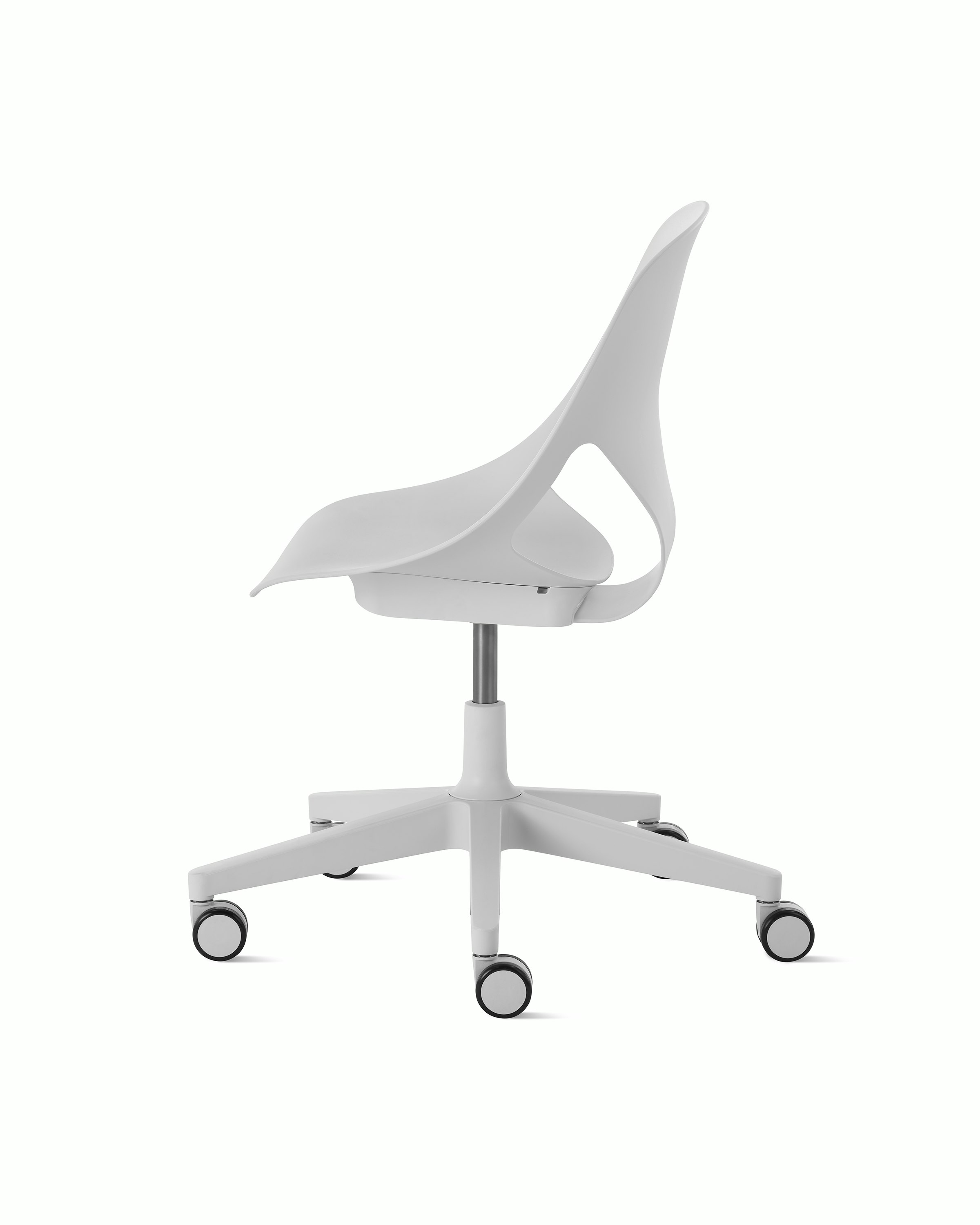 Side view of a light grey armless Zeph chair.