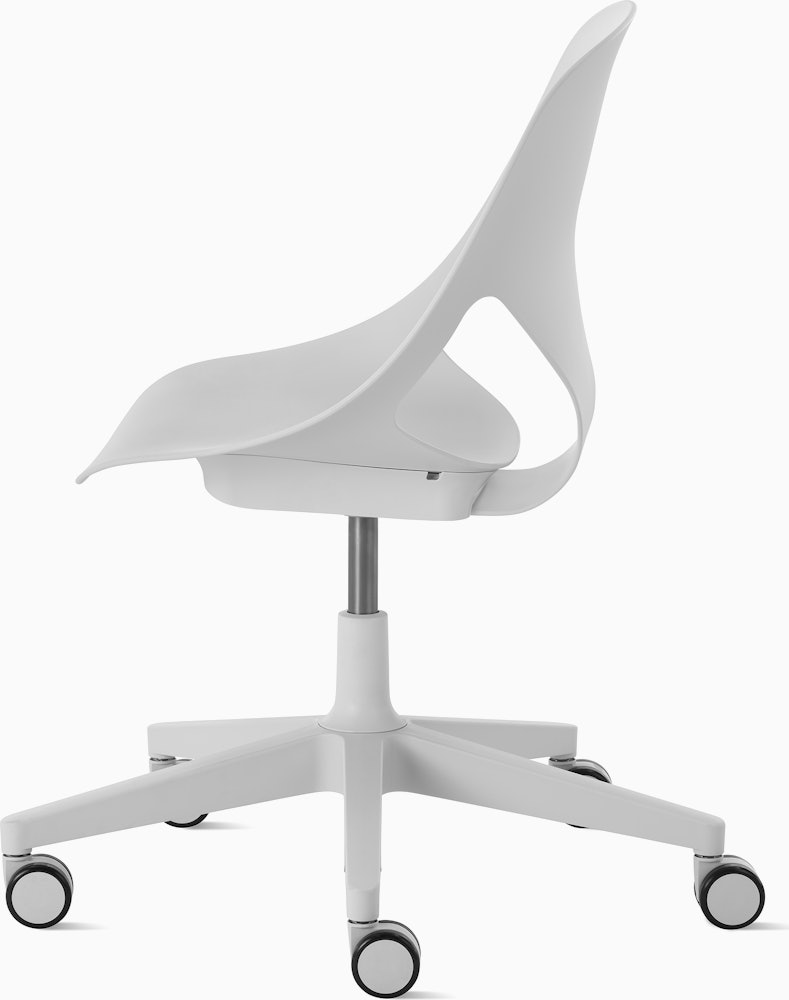 Side view of a light grey armless Zeph chair.